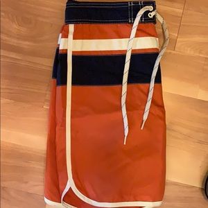 Navy and orange swim trunks
